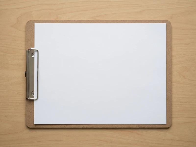 Single printed sheet held in a plain clipboard under daylight